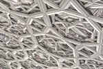 An high-definition photo of the intricate geometric patterns from the interior of the dome in the Louvre Abu Dhabi Museum by architect Jean Nouvel, United Arab Emirates.