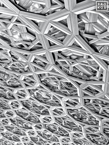 High-definition black and white photography of the geometric patterns from the interior of the dome at the Louvre Museum in Abu Dhabi, United Arab Emirates. Large-format limited edition prints of this photo are available up to 80 inches in height and framed in contemporary styles