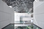 An architectural photo of the Interior of the Louvre Museum in Abu Dhabi, UAE by architect Jean Nouvel.