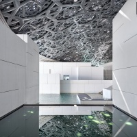 An architectural photo of the Interior of the Louvre Museum in Abu Dhabi, UAE by architect Jean Nouvel.