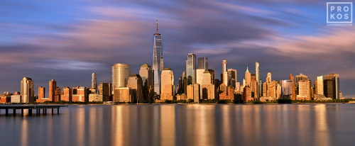 A skyline of Lower Manhattan and the World Trade Center at sunset, New York City
