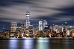 A long-exposure photo of the Lower Manhattan skyline and World Trade Center in New York City at night. Large-scale framed prints of this high-definition photo are available up to 120 inches in width. 