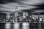 A black and white long-exposure photo of the Lower Manhattan skyline and World Trade Center at night, New York City. Large-scale framed prints of this high-definition photo are available up to 150 inches in width.