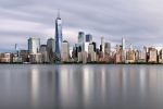 New York skyline photo of Lower Manhattan and the World Trade Center during the day. Captured with an eight minute long-exposure time by photographer Andrew Prokos