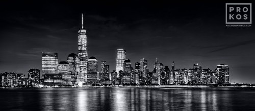 An ultra high-definition black and white skyline photo of Lower Manhattan, the Hudson River, and World trade Center at night as seen from New Jersey. Large-scale fine art prints of this photo are available up to 120 inches wide.