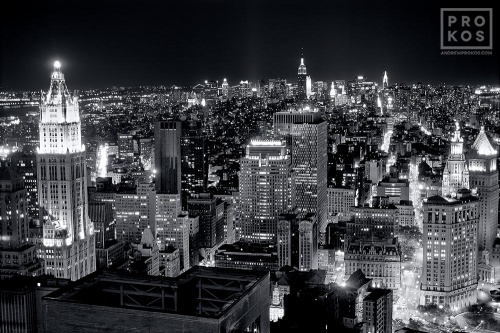 A black and white aerial view of the skyscraper of Lower Manhattan at night, New York City