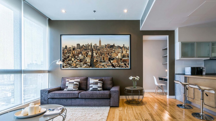 A large-scale high-definition New York cityscape photo by Photographer Andrew Prokos on display in a luxury residence.