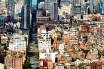 A large-format vertical cityscape of Manhattan and the Empire State Building as seen from SoHo during the day