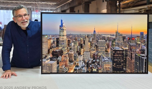 Photographer Andrew Prokos with a 50 inch framed limited edition print of Midtown Manhattan Cityscape at Dusk