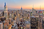 A high-definition cityscape capturing a wide angle view of Midtown Manhattan and the Empire State Building as seen from Rockefeller Center at dusk, New York City. Also shown are One Vanderbilt and the Bank of America building building. Large-format fine art prints of this photo available up to 120"