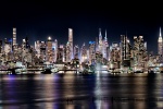 An ultra-wide panoramic view of the west side of Manhattan at night, stretching from Midtown to Hudson Yards. High-definition fine art prints of this photo are available up to 250 inches in width and framed in contemporary styles.