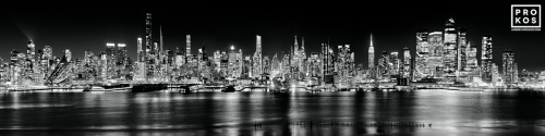 A black and white ultra-wide panoramic skyline of the west side of Manhattan at dusk stretching from Midtown to Hudson Yards. Large-format fine art prints of this photo are available up to 250 inches in width and framed in contemporary styles.