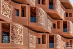 An architectural detail photo of the undulating terracotta facade of the Masdar Institute in Abu Dhabi, UAE by Foster + Partners. Limited edition fine art prints of this photo are available framed in various wood, metal, and acrylic styles. 