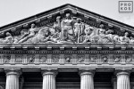 A black and white architectural photo of the pediment from the Mellon Auditorium building in Washington DC