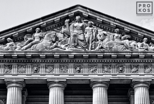 A black and white architectural photo of the pediment from the Mellon Auditorium building in Washington DC
