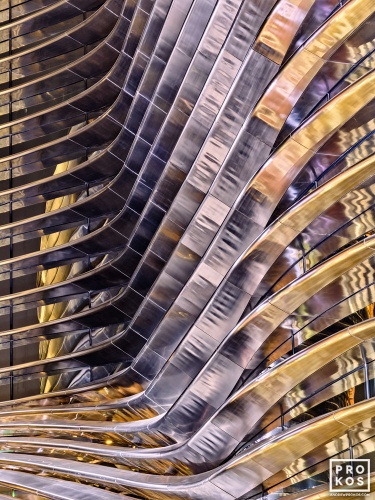 High-definition architectural photography of the curved stainless steel facade at the ALIF - Mobility Pavilion at the Dubai World Expo captured at night. Large-scale fine art prints of this photo are available up to 80 inches and framed in contemporary styles. 
