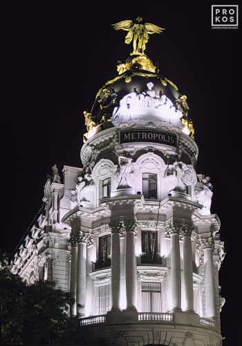 The landmark Metropolis Building at night, Madrid, Spain. Framed fine art prints of this photo are available in various sizes.
