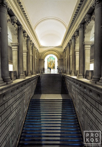 An architectural interior view of the Metropolitan Museum of Art's grand staircase leading to the European Paintings collection by photographer Andrew Prokos