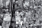 A vertical cityscape photo of Manhattan as seen from from SoHo in black and white.