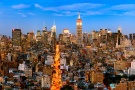 A panoramic cityscape of Manhattan with the Empire State Building and Chrysler building at dusk, New York City.