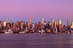 An ultra-wide panoramic view of the west side of Manhattan at dusk stretching from Midtown to Hudson Yards. This view includes the supertall towers of Billionaire's Row; including MOMA tower, One57, 111 W. 57th Street, 432 Park Avenue, and 220 Central Park South.  Also shown are One Vanderbilt, 270 Park Avenue (JP Morgan Chase tower), and 15, 30, 35, 50, and 55 Hudson Yards. High-definition fine art prints of this photo are available up to 250 inches in width and framed in contemporary styles.