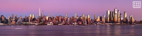 An ultra-wide panoramic view of the west side of Manhattan at dusk stretching from Midtown to Hudson Yards. This view includes the supertall towers of Billionaire's Row; including MOMA tower, One57, 111 W. 57th Street, 432 Park Avenue, and 220 Central Park South.  Also shown are One Vanderbilt, 270 Park Avenue (JP Morgan Chase tower), and 15, 30, 35, 50, and 55 Hudson Yards. High-definition fine art prints of this photo are available up to 250 inches in width and framed in contemporary styles.