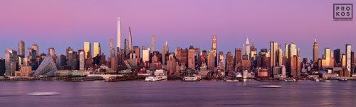 A high-definition panoramic skyline of the west side of Midtown Manhattan at dusk stretching from Via57 to the Empire State Building. This view includes the supertall towers of Billionaire's Row, including; MOMA tower, One57, 111 W. 57th Street, 432 Park Avenue, and 220 Central Park South.  Also shown are One Vanderbilt, 270 Park Avenue (JP Morgan Chase tower). High-definition fine art prints of this photo are available up to 250 inches in width and framed in contemporary styles.