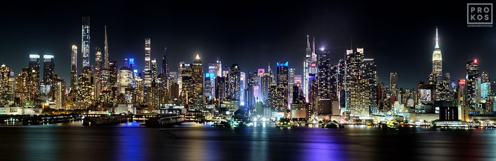 A New York City skyline of the panoramic view of Midtown Manhattan as seen from Weehawken, New Jersey at night. Large-format prints of this photo are available up to 120 inches in width, framed in wood, metal and acrylic styles.