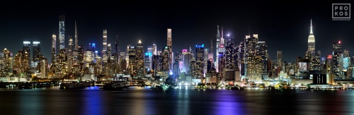A New York City skyline of the panoramic view of Midtown Manhattan as seen from Weehawken, New Jersey at night. Large-format prints of this photo are available up to 120 inches in width, framed in wood, metal and acrylic styles.
