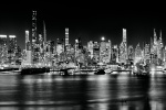 A black and white panoramic skyline of the west side of Midtown Manhattan at night stretching from Via57 to the Empire State Building. Large-format fine art prints of this photo are available up to 250 inches