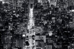 An ultra high-definition vertical cityscape of Manhattan at night in black and white. Large-scale fine art prints of this photo are available up to 120 inches in height.