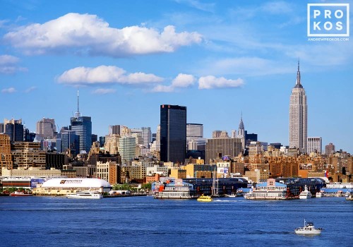 Skyline of New York City, the Hudson River, and Empire State Building during the day as seen from Hoboken, New Jersey