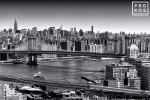 An aerial photo of Midtown Manhattan and the Manhattan Bridge in black and white, New York City