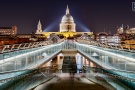 A view of the Millennium Bridge and St. Paul's Cathedral as seen at night, London, United Kingdom. Limited edition fine art prints are available up to 72 inches in width and framed in various wood, metal, and acrylic styles.