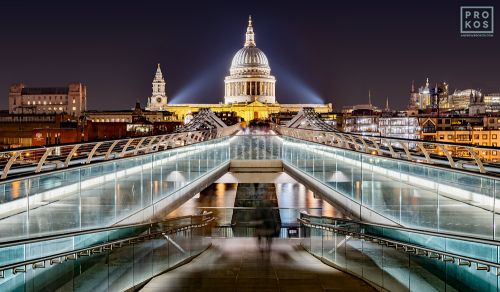 A view of the Millennium Bridge and St. Paul's Cathedral as seen at night, London, United Kingdom. Limited edition fine art prints are available up to 72 inches in width and framed in various wood, metal, and acrylic styles.