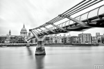 A black and white view of the Millennium Bridge, Thames River, and St. Paul's Cathedral, London captured with an eight minute long exposure by fine art photographer Andrew Prokos. Limited edition fine art prints of this photo are available up to 72 inches in width.