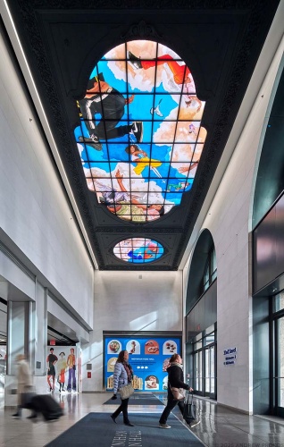 A view of the 33rd Street entrance of Moynihan Train Hall / Farley Building in Manhattan, New York City with the stained glass triptych "Go" by Kehinde Wiley. Captured by architectural photographer Andrew Prokos for Vornado Realty Trust. The renovation architect is Skidmore, Owings & Merrill (SOM). Fine art prints are available framed in wood, metal and acrylic styles.