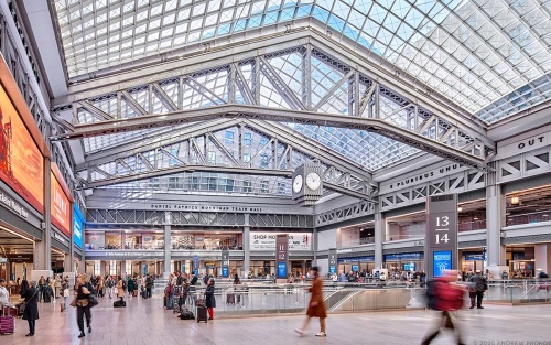 An interior view of Moynihan Train Hall in Manhattan, New York City as seen during the day. Captured by by architectural photographer Andrew Prokos for The Penn District / Vornado Realty Trust. Fine art prints are available framed in wood, metal and acrylic styles.