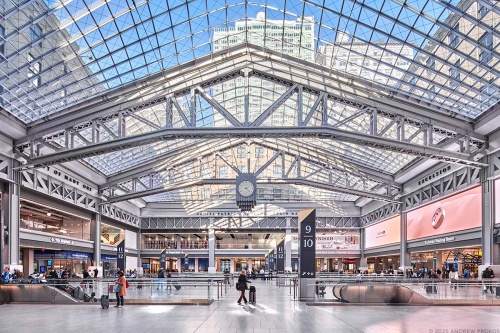 A view of the main concourse at Moynihan Train Hall, Penn Station / Farley Building in Manhattan, New York City as seen during the day. Captured by architectural photographer Andrew Prokos for Vornado. The architect is Skidmore, Owings & Merrill (SOM). Fine art prints are available in various sizes.