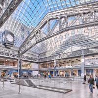 View of the main concourse of Moynihan Train Hall, Penn Station / Farley Building in New York City as seen during the day. Photo by architectural photographer Andrew Prokos for Vornado. The architect is Skidmore, Owings & Merrill (SOM). Fine art prints are available framed in various styles.