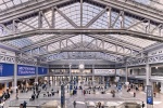 An elevated interior view of Moynihan Train Hall / Farley Building in Manhattan, New York City. Captured by architectural photographer Andrew Prokos for Vornado Realty Trust. The renovation architect is Skidmore, Owings & Merrill (SOM). Fine art prints are available framed in wood, metal and acrylic styles.