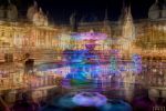 A multiple-exposure view of the fountains of Trafalgar Square, London at night from Andrew's photography series 'Multiplicity'. The pool reflects buildings on the square, including the National Portrait Gallery, and a pair of lovers is captured sitting at the edge of the pool in an embrace.