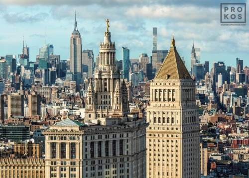 A view of the Municipal Building and 40 Centre Street in the foreground, with the skyscrapers of Midtown Manhattan and the Empire State Building in the distance, New York City