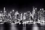 A black and white panoramic skyline of the lights of New York City and Midtown Manhattan at night, reflected on the Hudson River. Large-format fine art prints of this photo are available up to 120 inches in width and framed in wood, metal and acrylic styles.