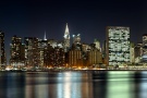 An ultra-wide skyline photograph of Midtown Manhattan at night, New York City