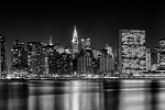 An ultra-wide skyline photograph of Midtown Manhattan at night in black and white, New York City