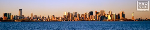 A panorama of the skyline of New York City and New York Harbor at sunset
