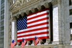A color architectural exterior photo of the New York Stock Exchange (NYSE) and American flags