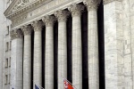 A fine art architectural photo of the facade of the New York Stock Exchange (NYSE) during the day