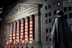 An architectural fine art photo of the New York Stock Exchange (NYSE) and statue of George Washington at night from Federal Hall